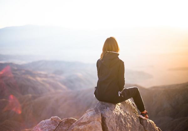 Women sitting on Mountain peak