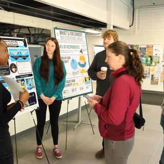 Students presenting poster.