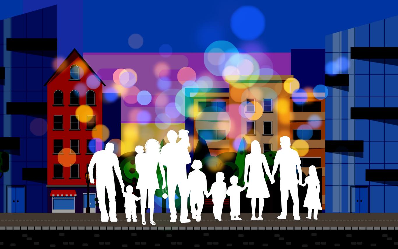 White cutout figures of people in front of a building backdrop. Community