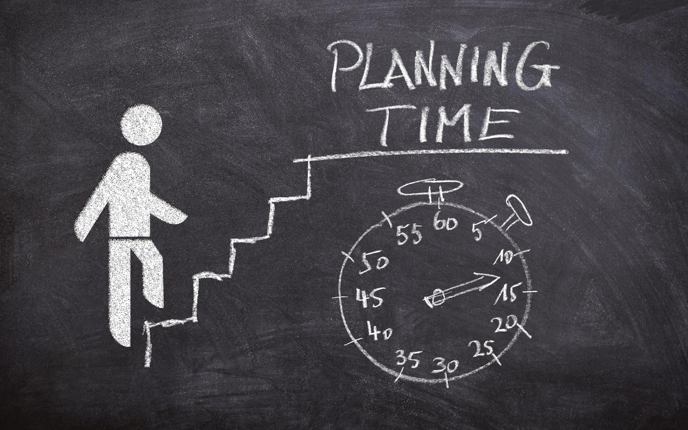 blackboard with person walking up a staircase  with a clock and planning time written above the clock