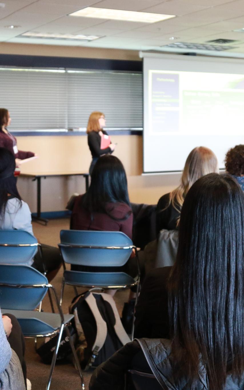 Students delivering a presentation at CREATE