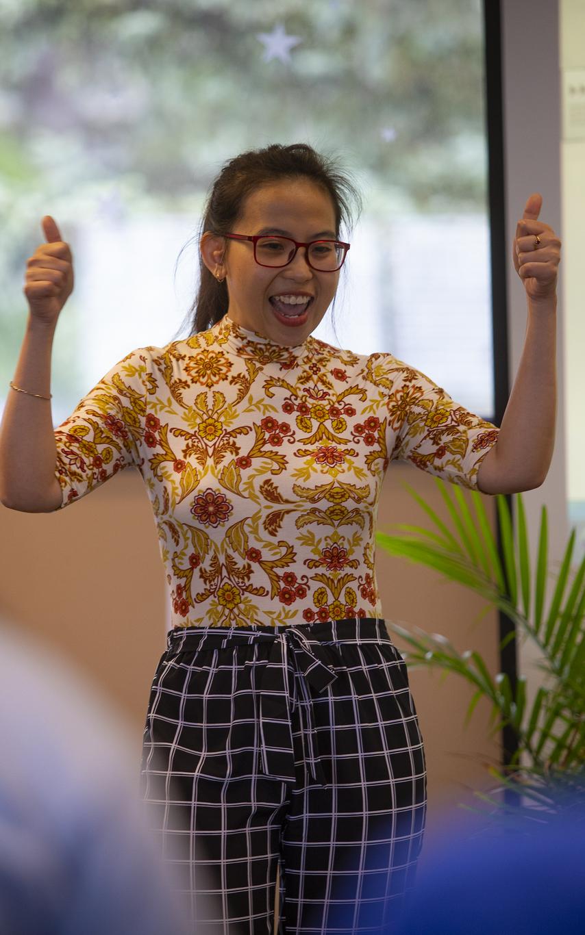 Student celebrating the completion of her 3MT